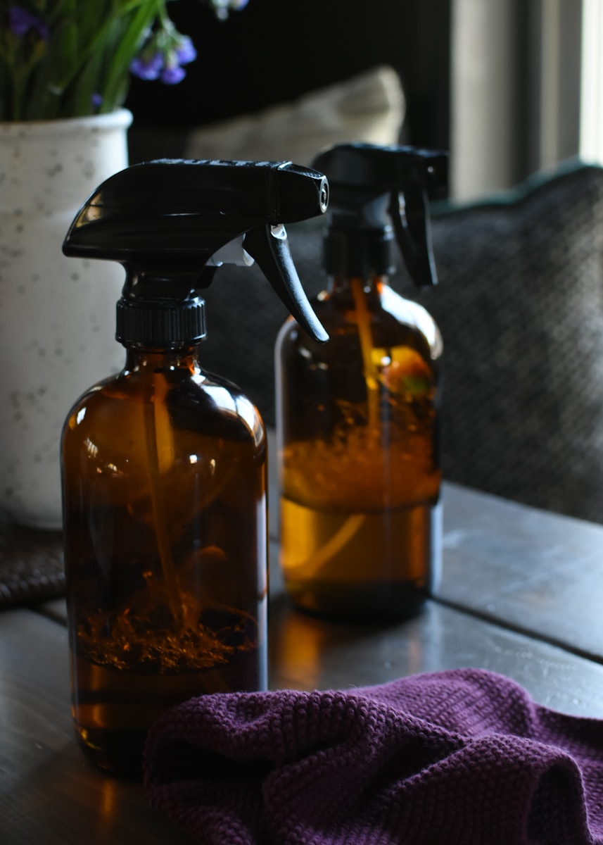 a couple of bottles sitting on top of a wooden table